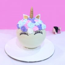 Unicorn pinata cake with hammer